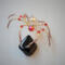Handmade gold and red beaded spider ornament with faceted crystal body, metallic gold wire legs, and fiery glass bead accents 
